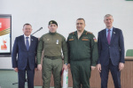Медалью 
